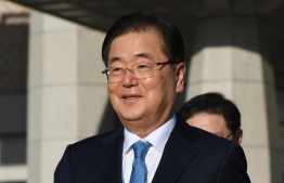Chung Eui-yong, head of the presidential National Security Office, walks to board an aircraft as they leave for Pyongyang at a military airport in Seongnam, south of Seoul, on September 5, 2018. 

A high-level South Korean delegation left for North Korea on September 5, to discuss arrangements for an inter-Korean summit there this month, as relations grow cooler between Washington and Pyongyang.  / AFP PHOTO / pool / Jung Yeon-je