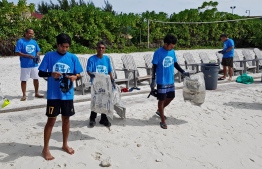 During a cleanup organised by Let's do it!Maldives. PHOTO/LET'S DO IT! MALDIVES