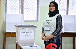 September 23, 2018: An election official stands beside a ballot box during the Presidential Elections 2018. PHOTO: NISHAN ALI/MIHAARU