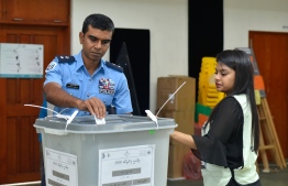 September 23, 2018: A police officer casts his ballot in the Presidential Elections 2018. PHOTO: AHMED NISHAATH/MIHAARU