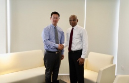 Chinese Ambassador to Maldives Zhang Lizhong with President Ibrahim Mohamed Solih in October 2019. PHOTO: MIHAARU