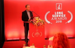 Bank of Maldives CEO Andrew Healy addresses the gathering, thanking awardees for their hard work and dedication. PHOTO: BANK OF MALDIVES / THE EDITION