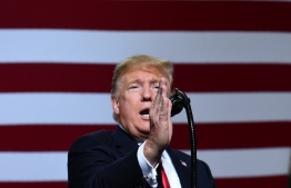 US President Donald Trump speaks during a "Make America Great" rally in Mesa, Arizona on October 19, 2018. - US President Donald Trump said Friday, October 19, 2018, that he found credible Saudi Arabia's assertion that dissident journalist Jamal Khashoggi died as a result of a fight. (Photo by Nicholas Kamm / AFP)