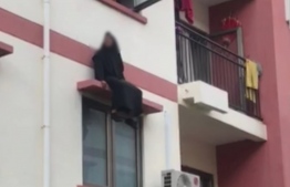 MNDF saved a local woman known to be suffering from mental illness during an attempt to jump from two-story building in reclaimed suburb of Hulhumale. PHOTO: MIHAARU