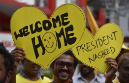 November 1, 2018, Male City: Supporters hold up placards to welcome former President Mohamed Nasheed upon his return to Maldives after 3 years. PHOTO: AHMED NISHAATHI/MIHAARU