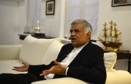 In this photo taken on November 2, 2018, Sri Lanka's ousted prime minister Ranil Wickremesinghe speaks during an interview with AFP in Colombo. - Sri Lanka's sacked prime minister Ranil Wickremesinghe has warned time is running out to avert a "bloodbath" while voicing hope that parliament will resolve a damaging constitutional crisis in the coming days, in an interview with AFP. (Photo by LAKRUWAN WANNIARACHCHI / AFP) / 
