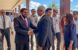 President-Elect Ibrahim Mohamed Solih (C) shakes hands with Jumhooree Party leader Qasim Ibrahim at Velana International Airport, prior to his departure to Saudi Arabia. PHOTO: AHMED NISHAATH/MIHAARU