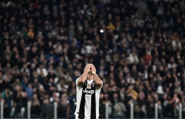 Juventus' Portuguese forward Cristiano Ronaldo reacts at the end of the UEFA Champions League group H football match Juventus vs Manchester United at the Allianz stadium in Turin on November 7, 2018. (Photo by Marco BERTORELLO / AFP)