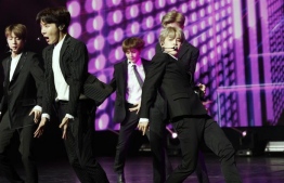 South Korean pop group BTS performs during a Korean cultural event in Paris [Yoan Valat/AP]