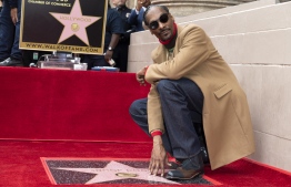 Rapper Snoop Dogg attends the ceremony honoring him with a Star on Hollywood Walk of Fame,  November 19, 2018 in Hollywood, California. (Photo by VALERIE MACON / AFP)