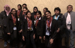 The students who won medals at the World Scholar's Cup along with school officials. PHOTO: GIYAASUDDIN INTERNATIONAL SCHOOL