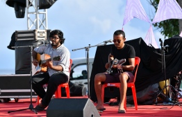 Local musicians Hafaf Malik and Ahmed Affan (Appi) performing at the 5-year anniversary show of 'Fannuge Dharin'. PHOTO: AHMED NISHAATH/MIHAARU