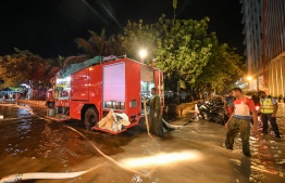 Maldives National Defence Force's Fire and Rescue Services pumping water from a flooded street in Male' on November 5. PHOTO: NISHAN ALI/MIHAARU