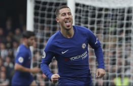 (FILES) In this file photo taken on December 2, 2017 Chelsea's Belgian midfielder Eden Hazard celebrates scoring his team's first goal during the English Premier League football match between Chelsea and Newcastle United at Stamford Bridge in London. - With the fate of Brexit shrouded in uncertainty, Britain's sporting world is increasingly concerned about the impact for players, fans and investors. Access to top European talent such as Chelsea's Belgian playmaker Eden Hazard is particularly important for the Premier League, the world's most lucrative tournament. (Photo by Daniel LEAL-OLIVAS / AFP)