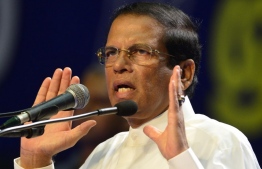 Sri Lanka's President Maithripala Sirisena attends the special Sri Lanka Freedom Party (SLFP) convention in Colombo on December 04, 2018.  (Photo by LAKRUWAN WANNIARACHCHI / AFP)