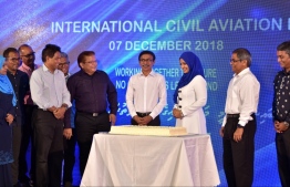 Transport Minister Aishath Nahula (3rd R) with Transport Ministry officials attend World Aviation Day ceremony. PHOTO: HUSSAIN WAHEED/MIHAARU