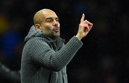 Manchester City's Spanish manager Pep Guardiola shouts instructions to his players from the touchline during the English Premier League football match between Watford and Manchester City at Vicarage Road Stadium in Watford, north of London. PHOTO: BEN STANSALL / AFP