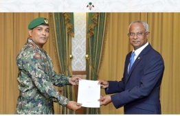 President Ibrahim Mohamed Solih (R) on Tuesday presents credentials to Abdulla Shamaal after the latter's appointment as Chief of Defence Force.