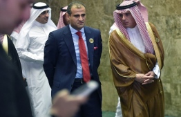 Saudi Foreign Minister Adel al-Jubeir (R) escorts Yemen's Deputy Foreign Minister Mohammed Hadrami (C) as they arrive to attend a meeting of foreign ministers of countries from seven Arab and African states surrounding the Red Sea and the Gulf of Aden, in the Saudi capital Riyadh on December 12, 2018. (Photo by FAYEZ NURELDINE / AFP)