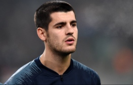 Chelsea's Spanish forward Alvaro Morata poses for a family picture during the UEFA Europa League Group L football match between MOL Vidi FC and Chelsea on December 13, 2018 in Budapest. (Photo by ATTILA KISBENEDEK / AFP)