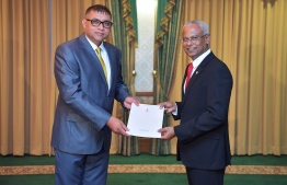 President Ibrahim Mohamed Solih (R) awards letter of appointment to Ahmed Adhil, State Minister for Transport. PHOTO/PRESIDENT'S OFFICE
