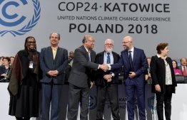 (From L to R) UN climate chief Patricia Espinosa, Iran's head of delegation Majid Shafiepour Motlagh, China's top climate negotiator Xie Zhenhua, European Union's climate commissioner Miguel Arias Canete, COP24 president Michal Kurtyka react at the end of the final session of the COP24 summit on climate change in Katowice, southern Poland, on December 15, 2018. (Photo by Janek SKARZYNSKI / AFP)