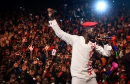 Ugandan musician-turned-politician Bobi Wine had been due to perform a gig near Kampala when police raided his hotel, his lawyer said. PHOTO: AFP