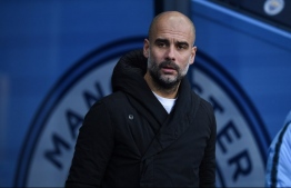 Manchester City's Spanish manager Pep Guardiola arrives for the English Premier League football match between Manchester City and Crystal Palace at the Etihad Stadium in Manchester, north west England, on December 22, 2018. (Photo by Oli SCARFF / AFP)