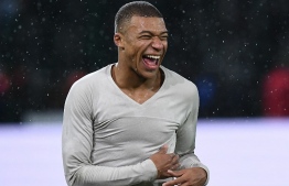 Paris Saint-Germain's French forward Kylian Mbappe celebrates at the end of the French League Cup round of sixteen football match Orleans vs Paris Saint-Germain (PSG), on December 18, 2018 at La Source stadium in Orleans. (Photo by FRANCK FIFE / AFP)