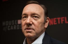 (FILES) In this file photo taken on February 22, 2016 Actor Kevin Spacey arrives at the season 4 premiere screening of the Netflix show "House of Cards" in Washington, DC. MRC, the production company that made House of Cards, filed the case against Spacey in 2019 as his sudden exit from the show due to sexual harassment allegations caused substantial loss of revenue for the company . -- Photo: Nicholas Kamm / AFP