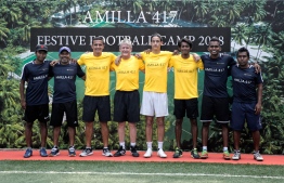 Tim Cahill, son Kyah Cahill and the rest of the coaching staff pose for a picture following the conclusion of the football camp. PHOTO: HAWWA AMANY ABDULLA/THE EDITION