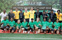 Tim Cahill alongside his coaching staff and festival camp officials pose for a photo during the closing ceremony of the camp. PHOTO: HAWWA AMANY ABDULLA/THE EDITION