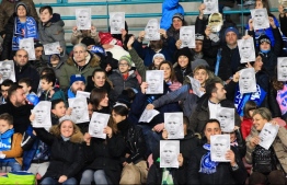 Napoli fans hold porraits of Napoli's Senegalese defender Kalidou Koulibaly prior to the Italian Serie A football match Napoli vs Bologna on December 29, 2018 at the San Paolo stadium in Naples. - Napoli's French-born Koulibaly was targeted by monkey noises and racist chants on December 26, 2018 at the San Siro stadium in Milan, before being sent off for sarcastically applauding the referee. (Photo by Carlo Hermann / AFP)