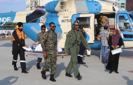 An elderly patient earlier being flown in from Muli Regional Hospital in Meemu Atoll to capital Male', on the India-gifted 'Rehendhi' helicopter.-- Photo: MNDF