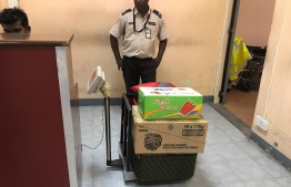 Luggage weighed on a simple scale at Hanimaadhoo Airport. PHOTO/MIHAARU