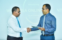 Minister of Communications Science and Technology Mohamed Maleeh Jamaal integrates the online portal for work VISA fees. PHOTO: AHMED NISHAATH/MIHAARU