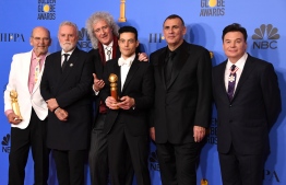 Best Actor in a Motion Picture – Drama for "Bohemian Rhapsody" winner Rami Malek poses with Graham King (2ndR), Brian May (3rdL) and Mike Myers (R) in the press room during the 76th annual Golden Globe Awards on January 6, 2019, at the Beverly Hilton hotel in Beverly Hills, California. 
Mark RALSTON / AFP