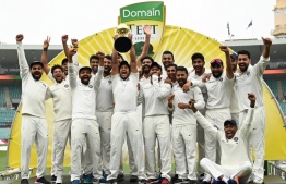India's team celebrate their series win on the fifth day of the fourth and final cricket Test against Australia at the Sydney Cricket Ground in Sydney on January 7, 2019. (Photo by PETER PARKS / AFP) / 