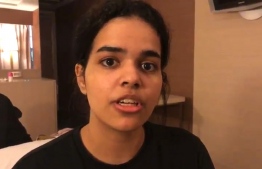This screen grab from a video released to AFPTV via the Twitter account of Rahaf Mohammed al-Qunun on January 7, 2019 shows a still of Qunun speaking in Bangkok on January 7. - Rahaf Mohammed al-Qunun held at Bangkok airport said she would be killed if she was repatriated by Thai immigration officials, who confirmed the 18-year-old was denied entry to the country on January 6. Qunun told AFP she was stopped by Saudi and Kuwaiti officials when she arrived in Suvarnabhumi airport in Bangkok and her travel document was forcibly taken from her, a claim backed by Human Rights Watch. (Photo by Handout / Courtesy of Rahaf Mohammed al-Qunun / AFP) / -----EDITORS NOTE --- RESTRICTED TO EDITORIAL USE - MANDATORY CREDIT "AFP PHOTO / TWITTER / Courtesy of Rahaf Mohammed al-Qunun" - NO MARKETING - NO ADVERTISING CAMPAIGNS - DISTRIBUTED AS A SERVICE TO CLIENTS - NO ARCHIVES