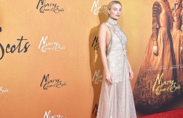 (FILES) In this file photo taken on December 4, 2018, actress Margot Robbie attends the New York premiere of "Mary Queen Of Scots." - Australian actress Margot Robbie will play the role of Mattel's iconic Barbie doll in the toy's first live-action film, Mattel and Warner Bros., said on January 8, 2019. Barbie, who will celebrate her 60th birthday this year, has already been the subject of dozens of animated movies, though none were ever distributed in theaters. (Photo by Michael loccisano / GETTY IMAGES NORTH AMERICA / AFP)
