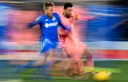 Getafe's Portuguese defender Vitorino Antunes (L) vies with Barcelona's Argentinian forward Lionel Messi during the Spanish League football match between Getafe CF and FC Barcelona at the Col. Alfonso Perez stadium in Getafe on January 6, 2019. (Photo by OSCAR DEL POZO / AFP)