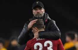 Liverpool's German manager Jurgen Klopp consoles Liverpool's Swiss midfielder Xherdan Shaqiri following the English FA Cup third round football match between Wolverhampton Wanderers and Liverpool at the Molineux stadium in Wolverhampton, central England on January 7, 2019. - Wolverhampton won the match 2-1. (Photo by Paul ELLIS / AFP) / RESTRICTED TO EDITORIAL USE. No use with unauthorized audio, video, data, fixture lists, club/league logos or 'live' services. Online in-match use limited to 120 images. An additional 40 images may be used in extra time. No video emulation. Social media in-match use limited to 120 images. An additional 40 images may be used in extra time. No use in betting publications, games or single club/league/player publications. / 