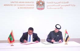 Minister of  Environment Dr Hussain Rasheed Hassan and Minister of Climate Change and Environment of the UAE Dr Thani Al Zeyoudi sign an MOU on renewable energy