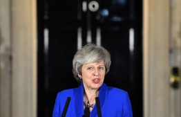 Britain's Prime Minister Theresa May delivers a speech to members of the media in Downing Street in London on January 16, 2019, after surviving a vote of no confidence in her government. - British Prime Minister Theresa May's government saw off a vote of no confidence in parliament on Wednesday, called after MPs overwhelmingly rejected the Brexit deal. (Photo by Ben STANSALL / AFP)