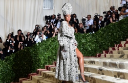 (FILES) In this file photo taken on May 8, 2018 Rihanna arrives for the 2018 Met Gala at the Metropolitan Museum of Art in New York. - Pop idol Rihanna is preparing to launch her own luxury brand with the world's biggest fashion conglomerate. According to Women's Wear Daily (WWD), Rihanna is in secret talks with the French giant LVMH. (Photo by Hector RETAMAL / AFP)
