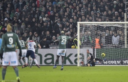 Lyon's French forward Moussa Dembele (3rd L) scores during the French L1 football match between Saint-Etienne (ASSE) and Lyon (OL) on January 20, 2019, at the Geoffroy Guichard stadium in Saint-Etienne, central-eastern France. (Photo by ROMAIN LAFABREGUE / AFP)
