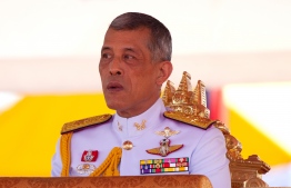 (FILES) This file photo taken on May 14, 2018 shows Thai King Maha Vajiralongkorn presiding over the annual royal ploughing ceremony outside Bangkok's royal palace. - Thailand's king has issued a royal decree endorsing the first general election since a 2014 coup, the palace said January 23, with the date of the long-delayed poll expected to announced within days. (Photo by Panupong CHANGCHAI / THAI NEWS PIX / AFP)