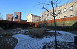 The new holocaust museum 'House of Fates' housed in what was the former 'Jozsefvarosi' railway station is pictured in Budapest on January 21, 2019. - As Hungarian Jews prepare to mark International Holocaust Remembrance Day Sunday, the community finds itself riven by a bitter dispute over the long-delayed opening of a Holocaust museum in Budapest. The "House of Fates" complex, fronted with two 15-metre-high towers of stacked cattle wagons connected by a giant floodlit metal bridge in the shape of the Jewish Star of David, dominates a boulevard on the run-down fringe of the city centre. (Photo by FERENC ISZA / AFP)
