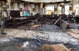 This handout photo released by Armed Forces of the Philippines (AFP) Public Information Office (PIO) Western Mindanao Command (WESTMINCON) taken on January 27, 2019, shows debris inside a Catholic Church where two bombs exploded in Jolo, Sulu province on the southern island of Mindanao. At least 17 people were killed as two bombs hit a church on a southern Philippine island that is a stronghold of Islamist militants, the military said, just days after a regional vote for a new Muslim autonomous region. The first blast occurred inside the Catholic church on war-torn Jolo on Sunday morning as mass was being celebrated, and was followed by a second explosion in the parking lot as troops responded, regional military spokesman Lieutenant Colonel Gerry Besana told AFP.