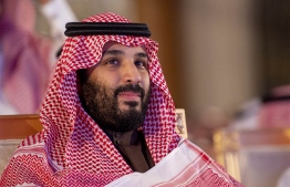 A handout picture provided by the Saudi Press Agency (SPA) on January 28, 2019 shows Crown Prince Mohammed bin Salman attending a ceremony at a hotel in Riyadh. - To kickstart the 12-year programme, the Gulf state announced the signing of 37 agreements worth $55 billion with foreign and local investors at a ceremony attended by Crown Prince Mohammed bin Salman. (Photo by STRINGER / various sources / AFP) / 